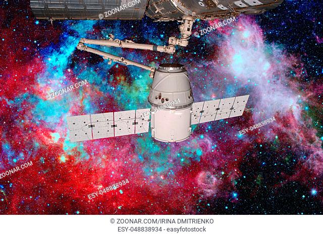 SpaceX Dragon orbiting the planet Earth. Elements of this image furnished by NASA