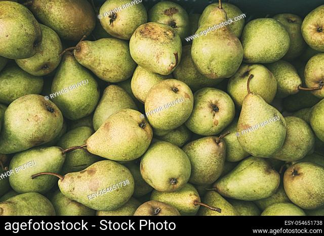 Green Ripe Pears At A Farmers Market. Top View Fruits Background