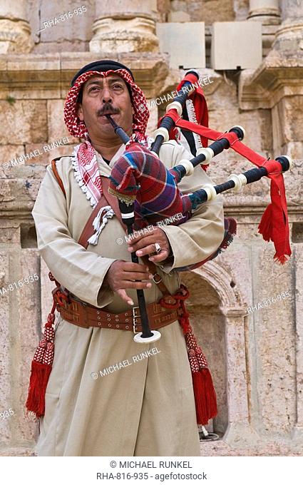 Bedouin playing the bagpipes in the old amphitheatre of Jerash, Jordan, Middle East