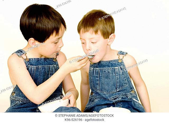 two boys eating