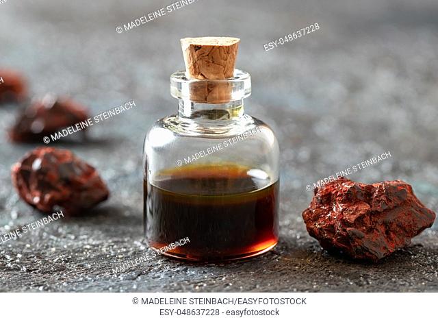 Croton lechleri, or sangre de drago oil and resin on a dark background