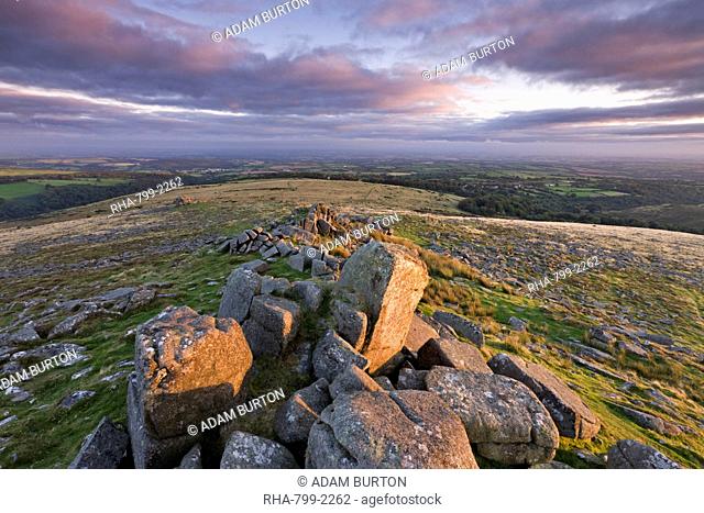 Early morning sunlight lights up the granite rocks of Belstone Tor, Dartmoor National Park, Devon, England, United Kingdom, Europe