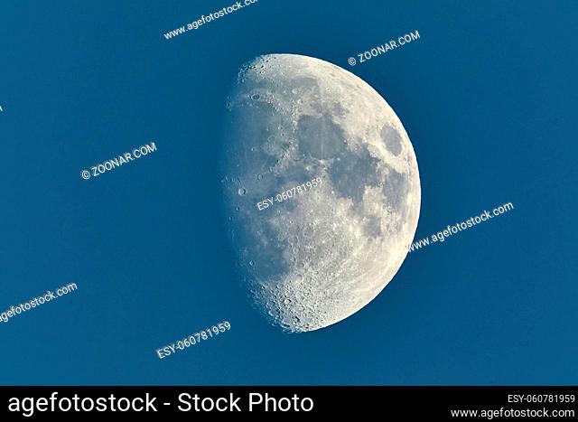 The Moon detailed shot in blue daylight sky, taken at 1600mm focal length, waxing gibbous phase