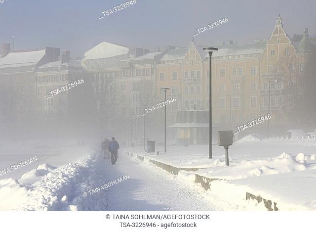 Helsinki, Finland - January 31, 2019: Coastal fog covers residential area of Merisatama in Helsinki, Finland as temperature drops