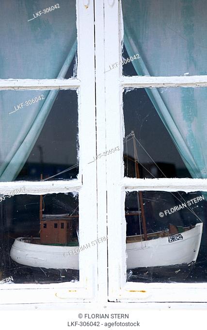 Ship model of a fishing boat standing in a window, Kaseberga, Ystad, Skane, South Sweden, Sweden