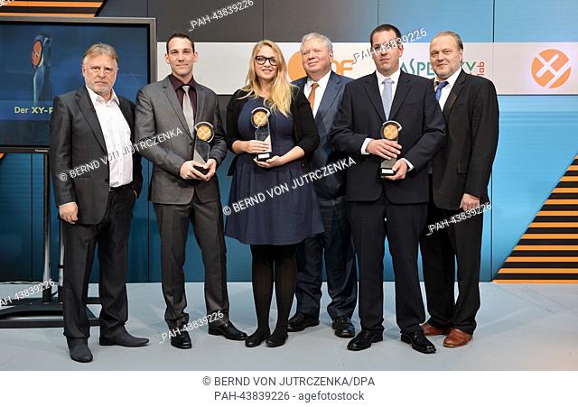 The prize winners of the XY Prize 2013 and their 'godfathers', Andreas Schmidt-Schaller (L-R) ad Christian Thoene, Paulina Hoppe and Rainer Hunold