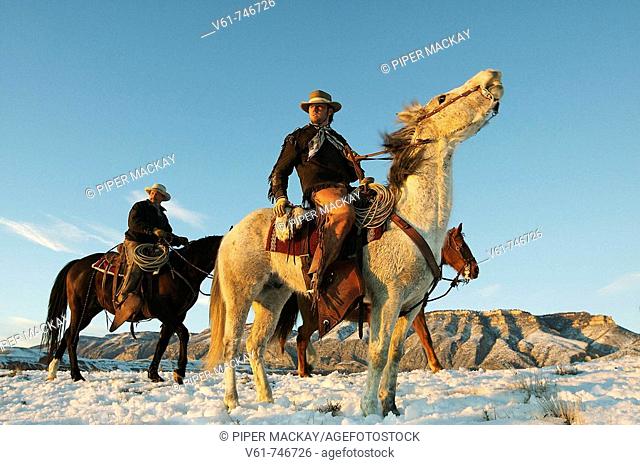 Cowboys out for a ride in winter, Shell, Wyoming, USA