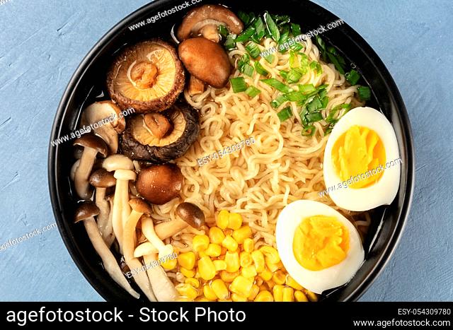 Ramen close-up. Soba with eggs, mushrooms, and vegetables, shot from the top