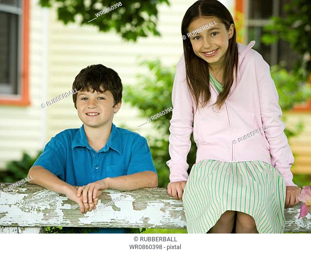 Portrait of a girl and a boy smiling