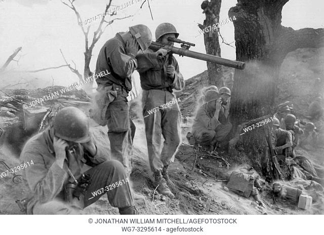 KOREA -- 05 Sep 1951 -- A rifle team of the 9th RCT, 2nd US Army Infantry Division, firing on a Communist position -- Picture by Burkholz / Lightroom Photos /...