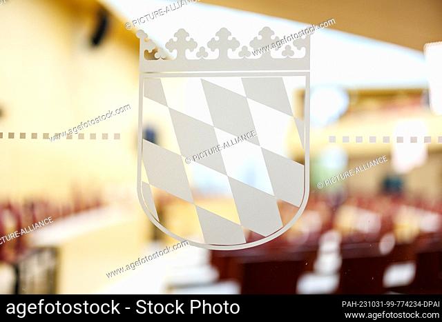 31 October 2023, Bavaria, Munich: The Bavarian rhombus can be seen on a glass pane to the plenary hall before the start of the second plenary session of the...