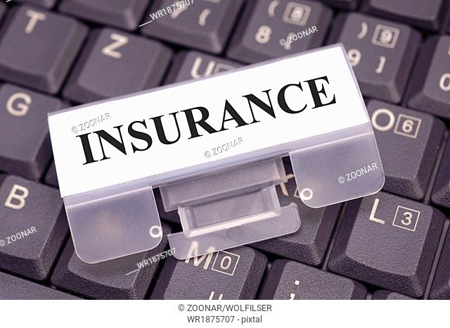 insurance marked on computer keyboard