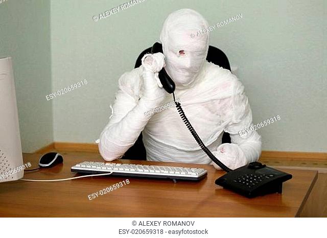 Businessman mummy with telephone