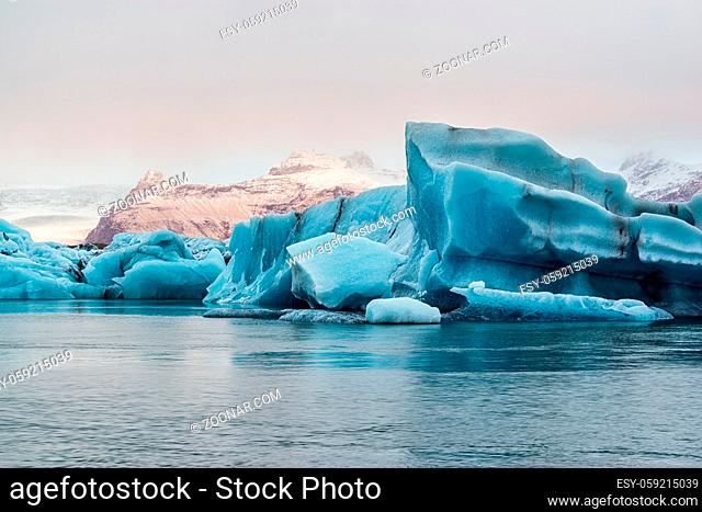 Icebergs in the Jokulsarlon's lake near Vatnajokull glacier at sunrise, Iceland