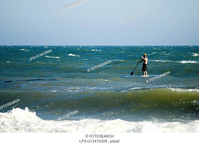 Stand up surfer