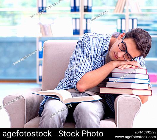 The student reading books and preparing for exams in library