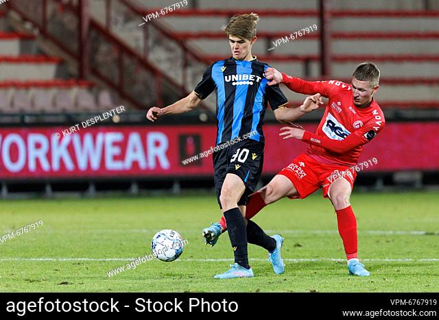 Kortrijk's Ante Palaversa and Club's Charles De Ketelaere fight for the ball during a soccer match between KV Kortrijk and Club Brugge