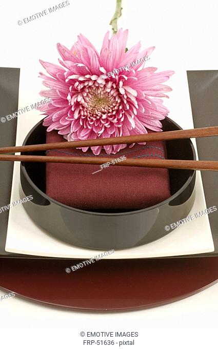 Asian place setting with a blossom