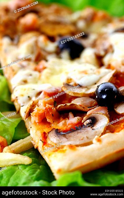 Slice of fresh pizza with olives and mushrooms isolated on white background