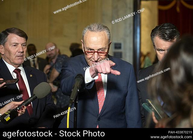 United States Senate Majority Leader Chuck Schumer (Democrat of New York), center, is joined by United States Senator Mike Rounds (Republican of South Dakota)