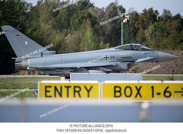 08 October 2018, Mecklenburg-Western Pomerania, Laage: A Eurofighter of the air force squadron 31 ""Boelcke"" from Nörvenich rolls after its landing on the air...