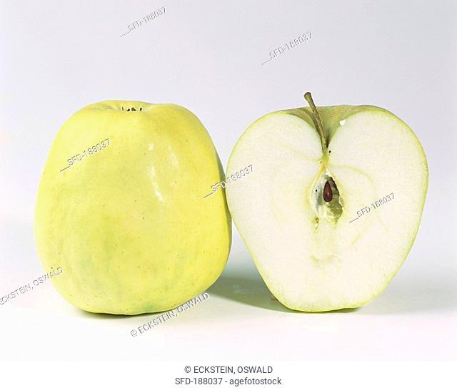 One half and one whole Glockenapfel apple