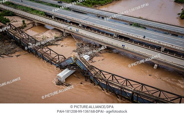 07 December 2018, Argentina, Pichanal: Wagons of a freight train of the Argentine state enterprise Belgrano Cargas, lie on a railway bridge over the Colorado...