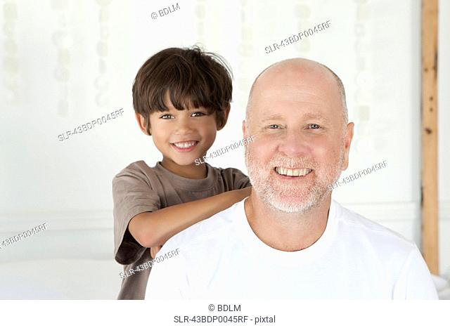Father and son smiling together