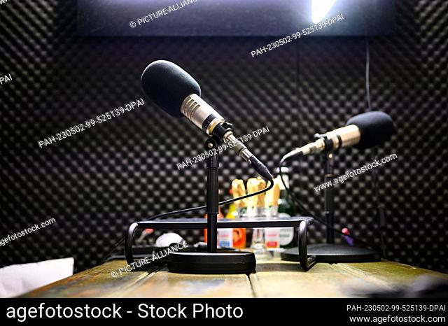 PRODUCTION - 17 April 2023, Hamburg: Podcast microphones stands in a recording studio on the premises of the company OMR
