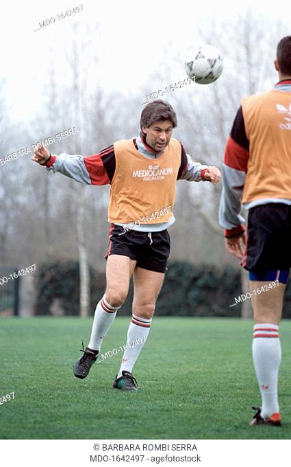 Carlo Ancelotti is heading the ball during a practice game. The Italian soccer midfielder Carlo Ancelotti is heading the ball during a practice game with Milan...