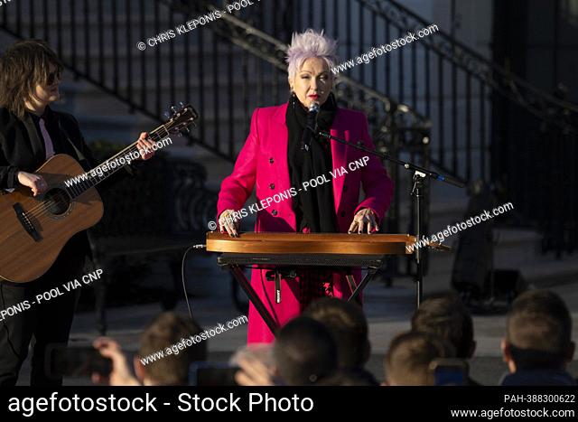 Singer Cyndi Lauper and guitarist Alex Nolan perform in a ceremony with US President Joe Biden to sign the Respect for Marriage Act on the South Lawn of the...