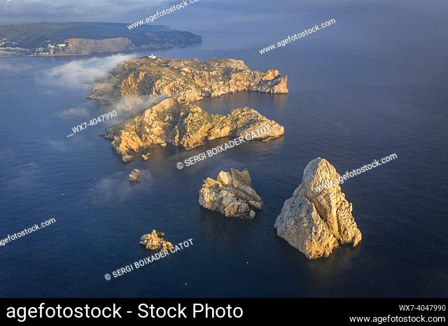 Aerial view of the Medes Islands in a foggy sunrise over the Costa Brava coast and Mediterrania sea (L'Estartit, Gerona, EmpordÃ , Catalonia, Spain)