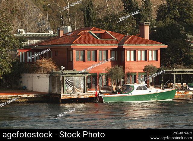 View of the traditional seaside residences or so-called waterside mansions of the red painted Ferruh Efendi Yalisi in Kanlica village