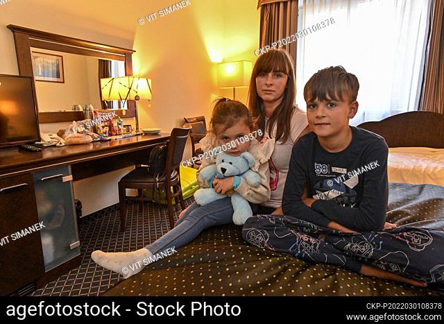 Anastasia Kupchynska with her ten-year-old son Danyl and her five-year-old daughter Rokcolana from the Ukrainian city of Ivano-Frankivsk rest in a hotel room in...