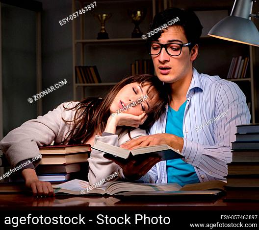 The two students studying late preparing for exams