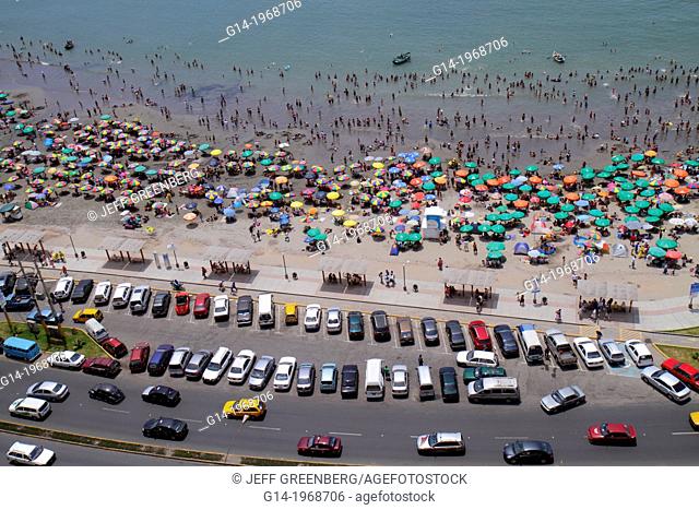 Peru, Lima, Barranco District, Malecon, Circuito de playas, Playa los Yuyos, Pacific Ocean, coast, aerial view, parking lot, car, beach, crowd, crowded