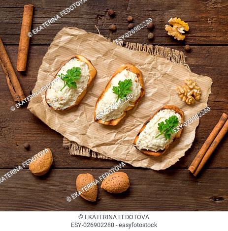 Toasted bread with a salted codfish mousse on a craft paper