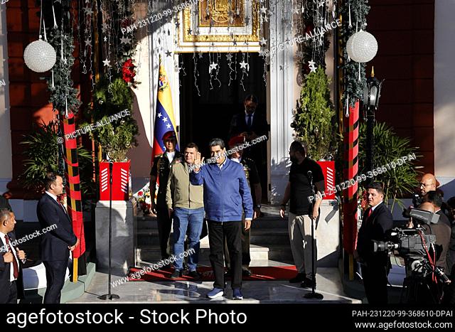 20 December 2023, Venezuela, Caracas: Nicolás Maduro (M), President of Venezuela, arrives to greet Colombian businessman Saab