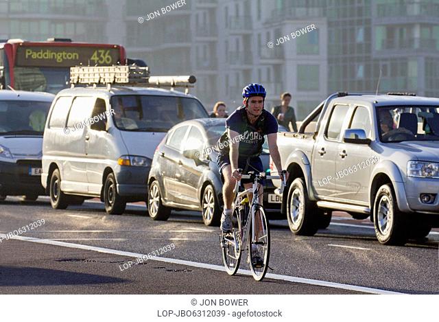 Cyclist and congested traffic on Vauxhall Bridge in London