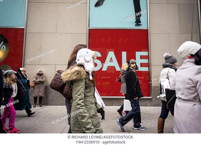 The H&M department store on Fifth Avenue in Midtown Manhattan in New York advertises its Christmas sales on Sunday, December 21, 2014