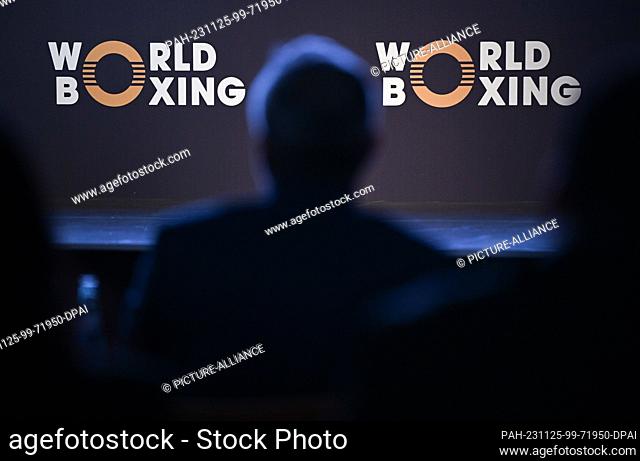 25 November 2023, Hesse, Frankfurt/Main: A delegate sits in front of the association's logo at the founding congress of the new World Boxing Association