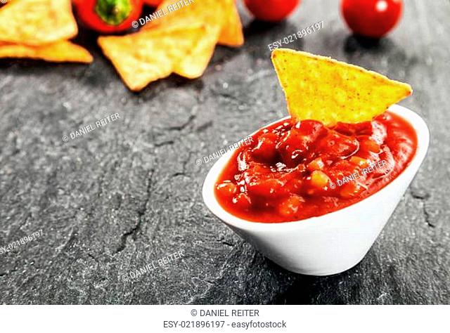 Hot spicy salsa sauce with corn tortillas