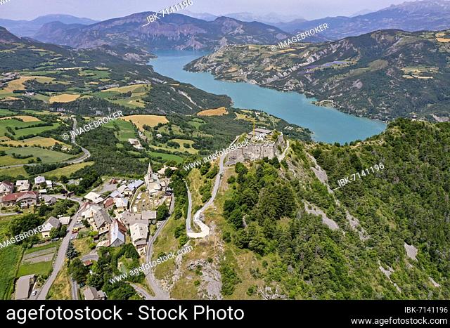 Drone shot, drone photo of the mountains around the church of Saint Vincent Les Forts overlooking the Ubaye Valley reservoir, Saint Vincent les Forts