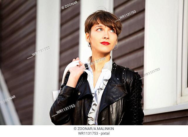 Young woman in leather jacket