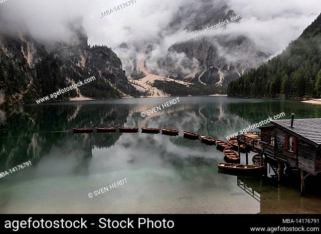 The boathouse on Lake Braies on a foggy day