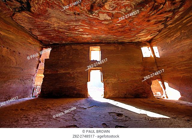 Light streaming through the windows of the Urn Tomb of the Royal Tombs in the rock city of Petra, Jordan