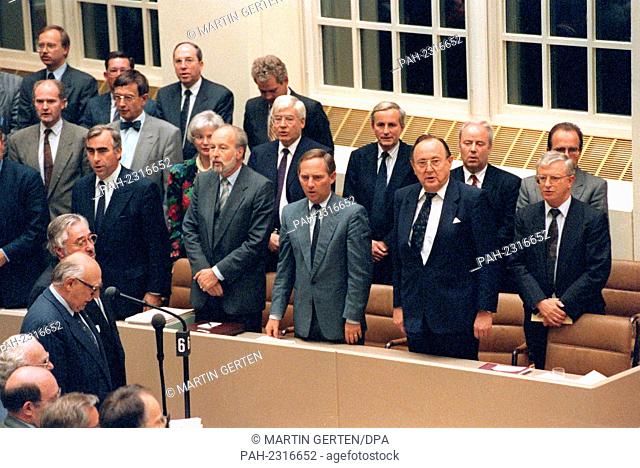 Members of the Bundestag, among them (L-R front) ministers Theo Waigel, Hans Engelhard, Wolfgang Schaeuble, Hans-Dietrich Genscher and Rudolf Seiters stand up...