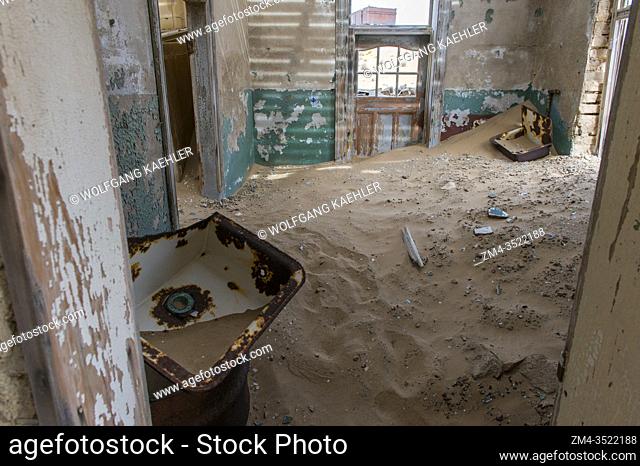Sand slowly filling a building in the abandoned (1954) German diamond mining settlement of Kolmanskop near Luderitz, Namibia