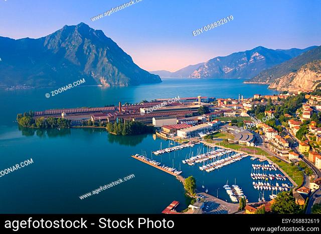 Aerial view of Lake Iseo at sunrise, on the right the port of lovere, background mountains(alps), Bergamo Italy