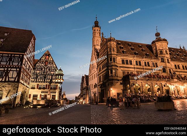Rothenburg ob der Tauber, Bavaria - Germany: Tourists walking at the market square in old town